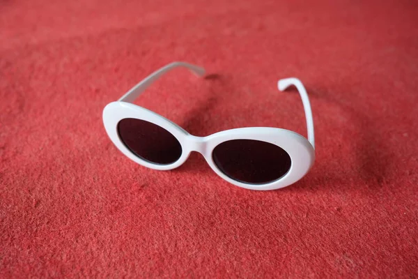 stock image White Children Eyeglass with red background