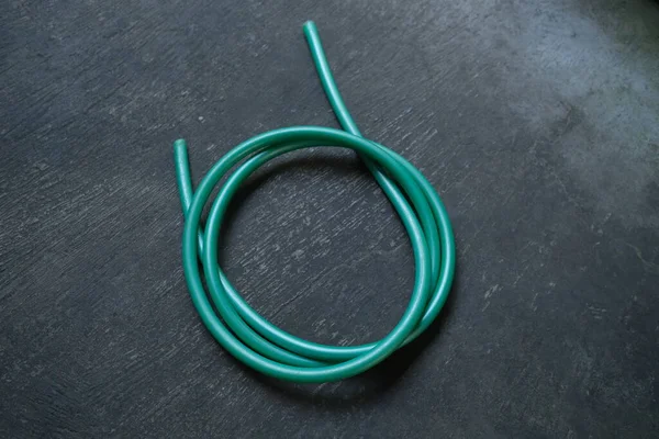 Photo Green Water Hose Roll — Stock Photo, Image