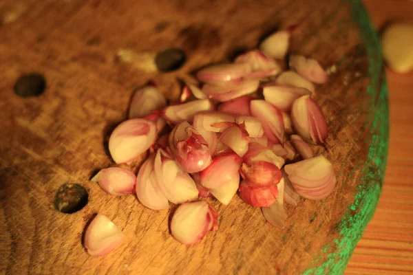 Stock image Photo of sliced red onion on a board