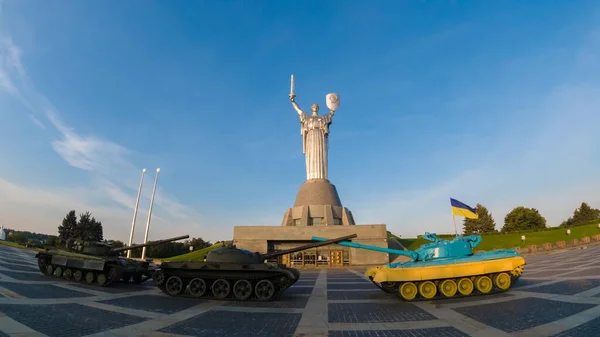 Museum of the History of Ukraine in World War II, Kiev.   Confrontation tanks on the background of the statue of Motherland. 