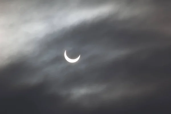 stock image Solar eclipse through dense clouds 