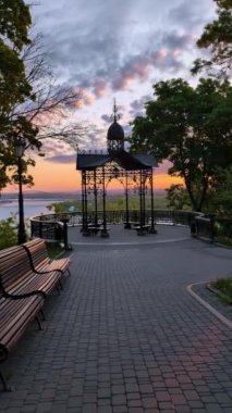 The cityscape in the early morning from the picturesque observation deck on the Volodymyrska Hill in Kyiv, Ukraine. Vertical video