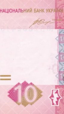 Otantik Ukrayna 10 Hryvnia banknotunun manzaralı dikey videosu, tarihi bir portre ve soldan sağa hareket eden pembe tonlarda karmaşık güvenlik modelleri içeriyor. Dikey Video