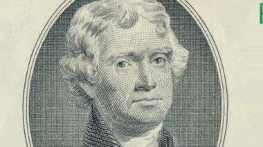 Thomas Jefferson 'ın kabartmalı portresini, mezhebini, seri numarasını ve yasal ihale beyanını gösteren 2 dolarlık banknotun detaylı görüntüsü. Amerikan para biriminin anahtar tasarım unsurlarını ve güvenlik özelliklerini vurgular