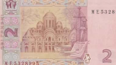 Ukrayna 2 Hryvnia banknotunun Kiev 'deki Sofya Katedrali' nin tam nottan mimari ayrıntılara zumlanması, ulusal mirası ve karmaşık tasarımı gösteren ayrıntılı görünümü