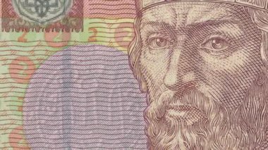 Bilge Yaroslav 'ın Ukrayna 2 Hryvnia banknotuna kazınmış portresi, ulusal semboller ve karmaşık koruyucu unsurlarla ortaçağ hükümdarının bilgeliğini ve gücünü gözler önüne seriyor.