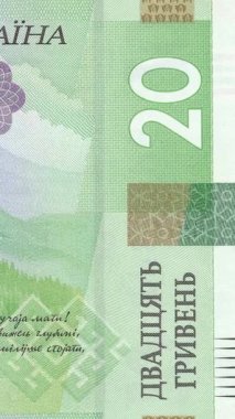 Dikey video 20 UAH banknot alanına yavaş yakınlaşmayı gösteriyor. Karmaşık güvenlik modelleri ve yeşil renk şemasında koruyucu unsurlar Ukrayna para birimi özgünlüğünü vurguluyor.