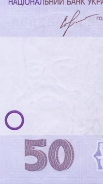 50 UAH banknotunun sol bölümünün detaylı görünümü, büyük ölçekli banknot sayısı ve geometrik desenler ve kendine özgü mor renk şeması içinde mikro metin içeren gelişmiş güvenlik unsurları içerir.