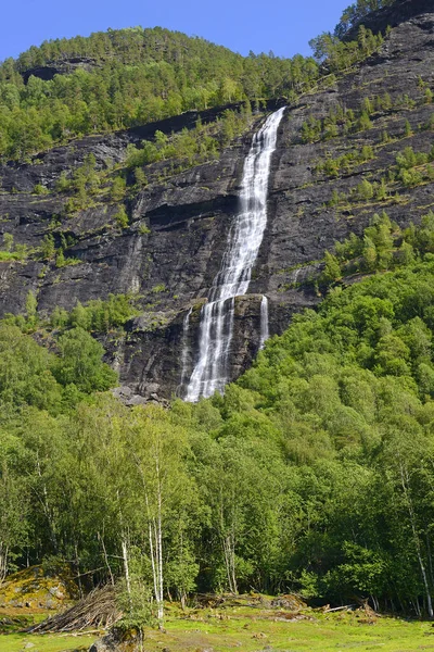 stock image Asafossen - Large Waterfall across Vassbakken by Skjolden. Asafossen is waterfall upstream of the scenic town of Skjolden as part of the memoral Sognefjell Alpine Road in Vestland, Norway