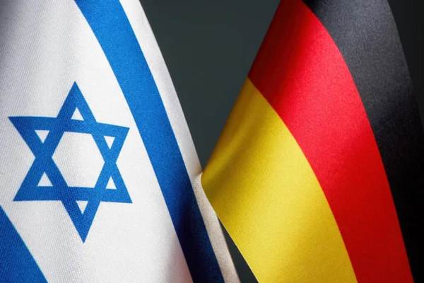 Flags of Germany and Israel as symbol of diplomatic relations.