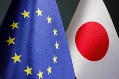The flags of the EU and Japan are side by side as concept of trade relations.