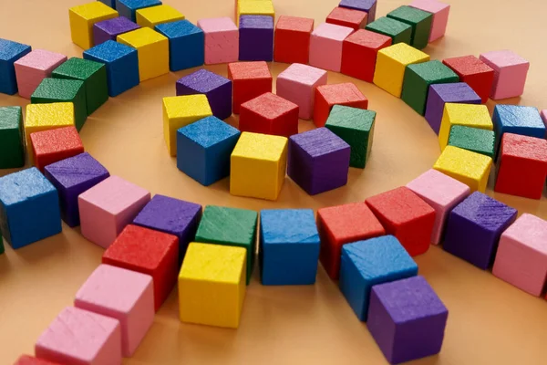 Circle of colored cubes. Abstract concept of a company structure and management.