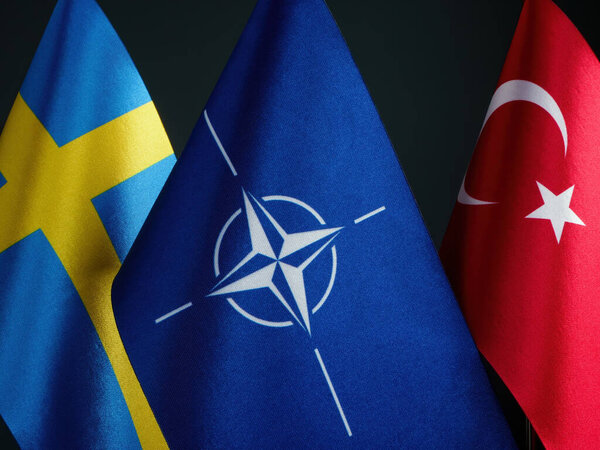KYIV, UKRAINE - April 04, 2023. Flags of Sweden, NATO and Turkey. Editorial.