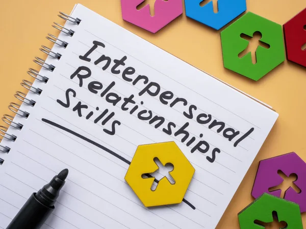 A Page with inscription Interpersonal Relationships skills and figurines.