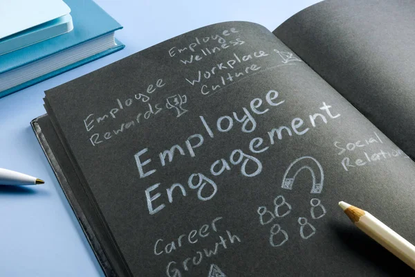 stock image Employee engagement handwritten by pencil and marks about it.