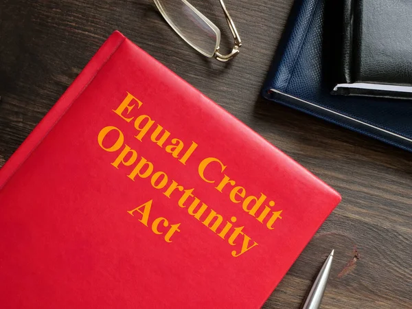 Equal Credit Opportunity Act ECOA book near glasses and a pen.