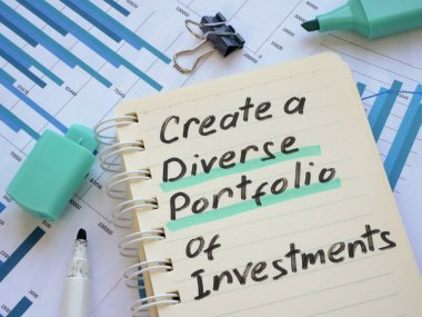 Written inscription Create a diverse portfolio of investments in the notebook. clipart