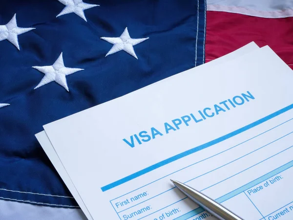 A Visa application form on the USA flag.