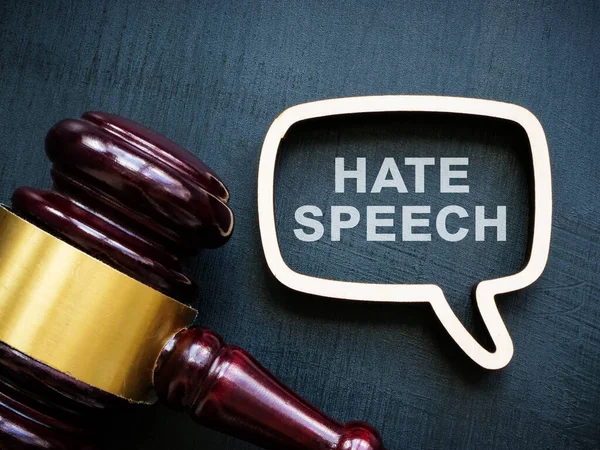 Speech bubble with sign hate speech and gavel.