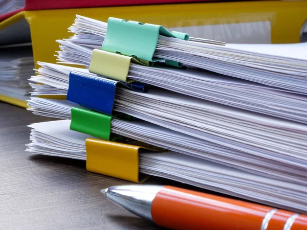 Stacks of papers for document flow, reporting in accounting and auditing.