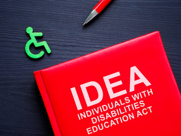 Book IDEA Individuals with disabilities education act and pen.