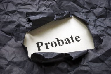 Yırtık siyah kağıt ve vasiyetname.