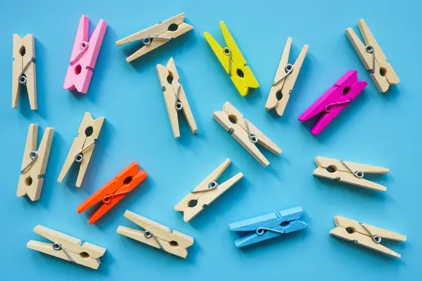 stock image Wooden and colored clothespins as symbol of inclusiveness in society.