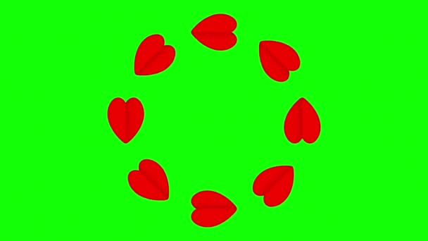 Yeşil Ekranda Kırmızı Kağıt Kalpler Daireler Çiziyor — Stok video