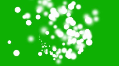 Yeşil ekran arka planına sahip beyaz bokeh parçacıkları hareket grafikleri