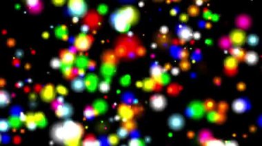 Dönen renkli bokeh parçacıkları düz siyah arkaplan ile hareket grafikleri