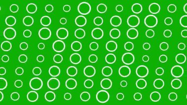 Yeşil ekran arka planında beyaz daireler hareket ediyor