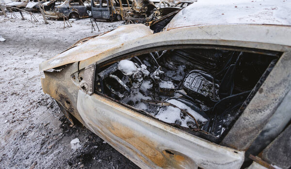 Kyiv, Ukraine - January 3, 2024: Burned civilians cars after a Russians missiles attack.