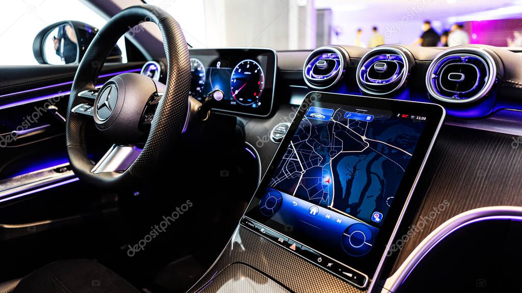 Kyiv, Ukraine - September 12: Mercedes-Benz luxury car interior showcasing the sleek design of the steering wheel, digital dashboard, and advanced navigation system
