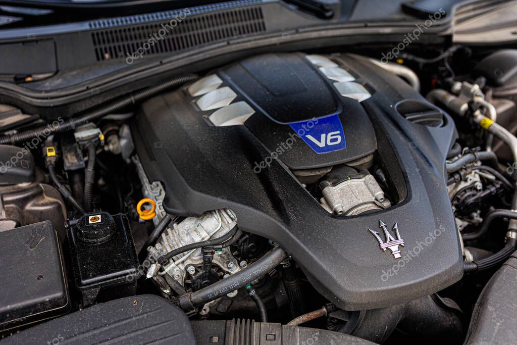 Kyiv, Ukraine - June 12, 2025: Powerful Maserati engine, showcasing intricate mechanical details and the iconic trident logo on the engine cover. Italclub gathering in Kyiv.
