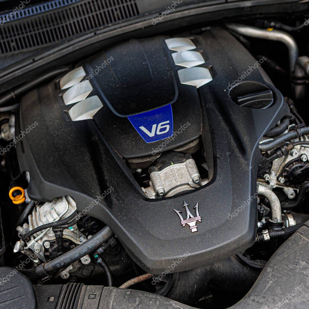 Kyiv, Ukraine - June 12, 2025: Powerful Maserati engine, showcasing intricate mechanical details and the iconic trident logo on the engine cover. Italclub gathering in Kyiv.