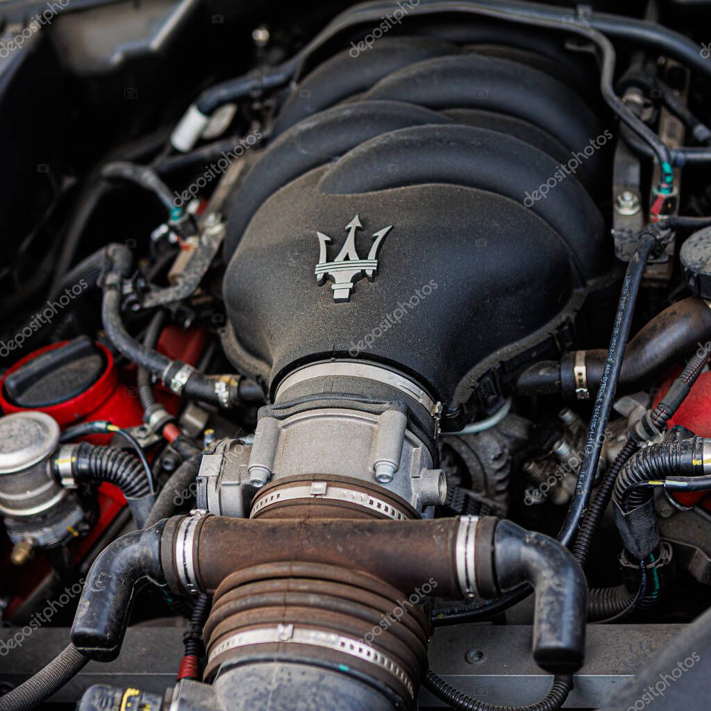 Kyiv, Ukraine - June 12, 2025: Powerful Maserati engine, showcasing intricate mechanical details and the iconic trident logo on the engine cover. Italclub gathering in Kyiv.