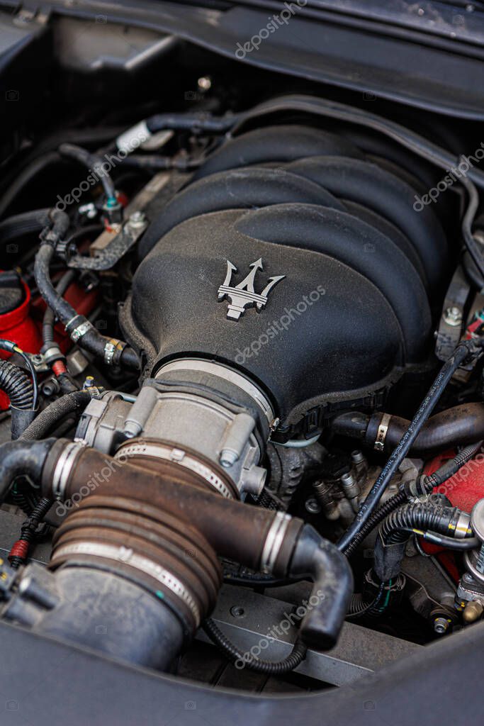 Kyiv, Ukraine - June 12, 2025: Powerful Maserati engine, showcasing intricate mechanical details and the iconic trident logo on the engine cover. Italclub gathering in Kyiv.