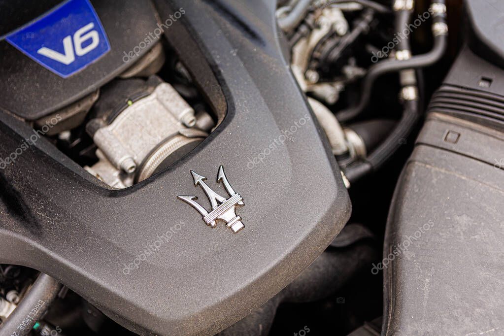 Kyiv, Ukraine - June 12, 2025: Powerful Maserati engine, showcasing intricate mechanical details and the iconic trident logo on the engine cover. Italclub gathering in Kyiv.
