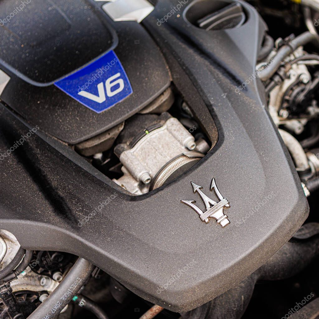 Kyiv, Ukraine - June 12, 2025: Powerful Maserati engine, showcasing intricate mechanical details and the iconic trident logo on the engine cover. Italclub gathering in Kyiv.