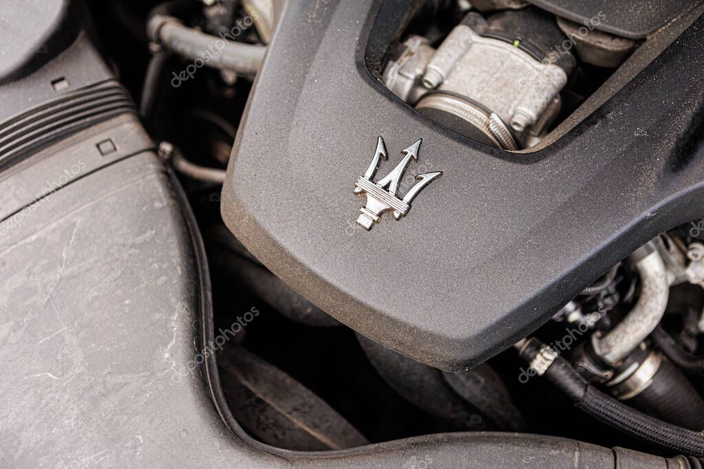 Kyiv, Ukraine - June 12, 2025: Powerful Maserati engine, showcasing intricate mechanical details and the iconic trident logo on the engine cover. Italclub gathering in Kyiv.