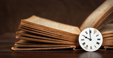 Old book and vintage clock with copy space. Story time, storytelling banner. clipart