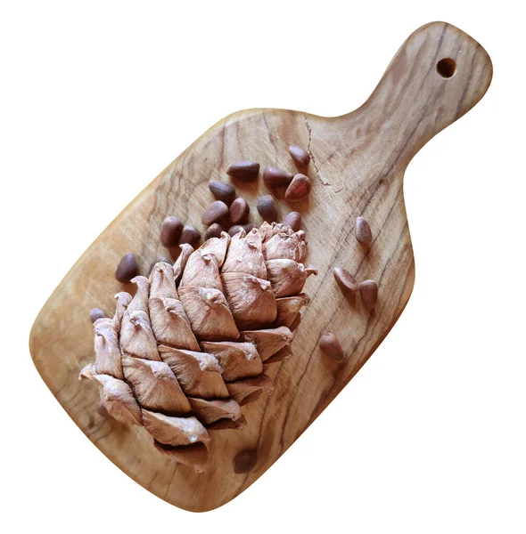 Cedar Cone Cedar Nuts Wooden Cutting Board Isolated White Clipping — Stock Photo, Image