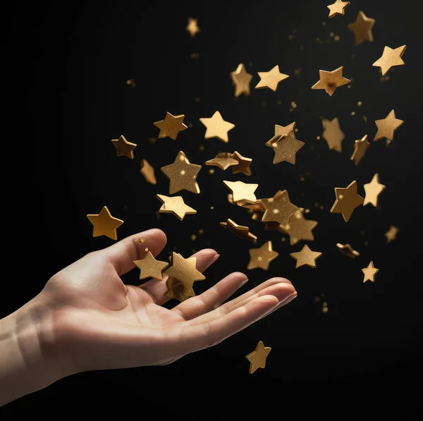 stock image Gold coins in the shape of a star fly out of the outstretched hand.