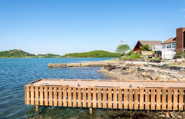Wooden jetties in Hafrsfjord residential suburb area, Stavanger, Norway, May 2018