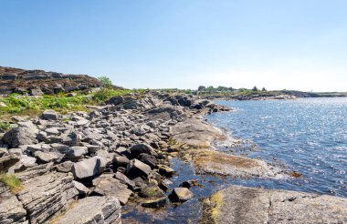Scenic rocky coastline view in Kvernevik suburb, Stavanger, Norway, May 2018