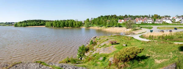 Panorama of Halandsvatnet lake coastline from a viewpoint hill next to the main car park, Stavanger, Norway, May 2018