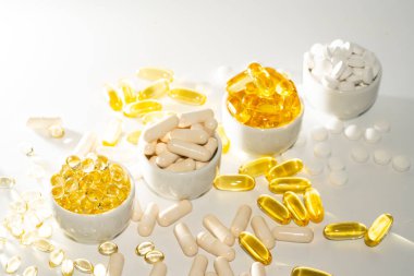 Food supplement oil filled fish oil, vitamin D, omega 3, omega 6, vitamin A, vitamin E, flaxseed oil. clipart