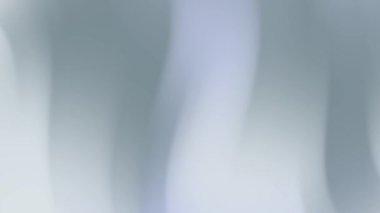 Yumuşak, dikey ışık çizgileriyle bulanık arkaplan. Çeşitli projelerde arkaplan, sunum, kaplama ve sanatsal tasarımlar için uygundur.