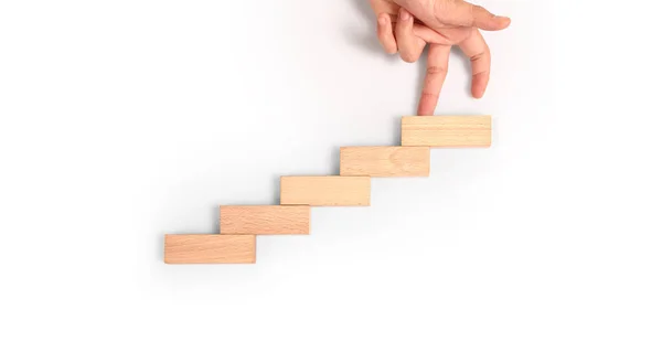 stock image Hand liken person stepping up a toy staircase wood