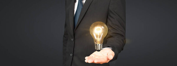 Humans hold light bulbs in hand innovative technology and creativity